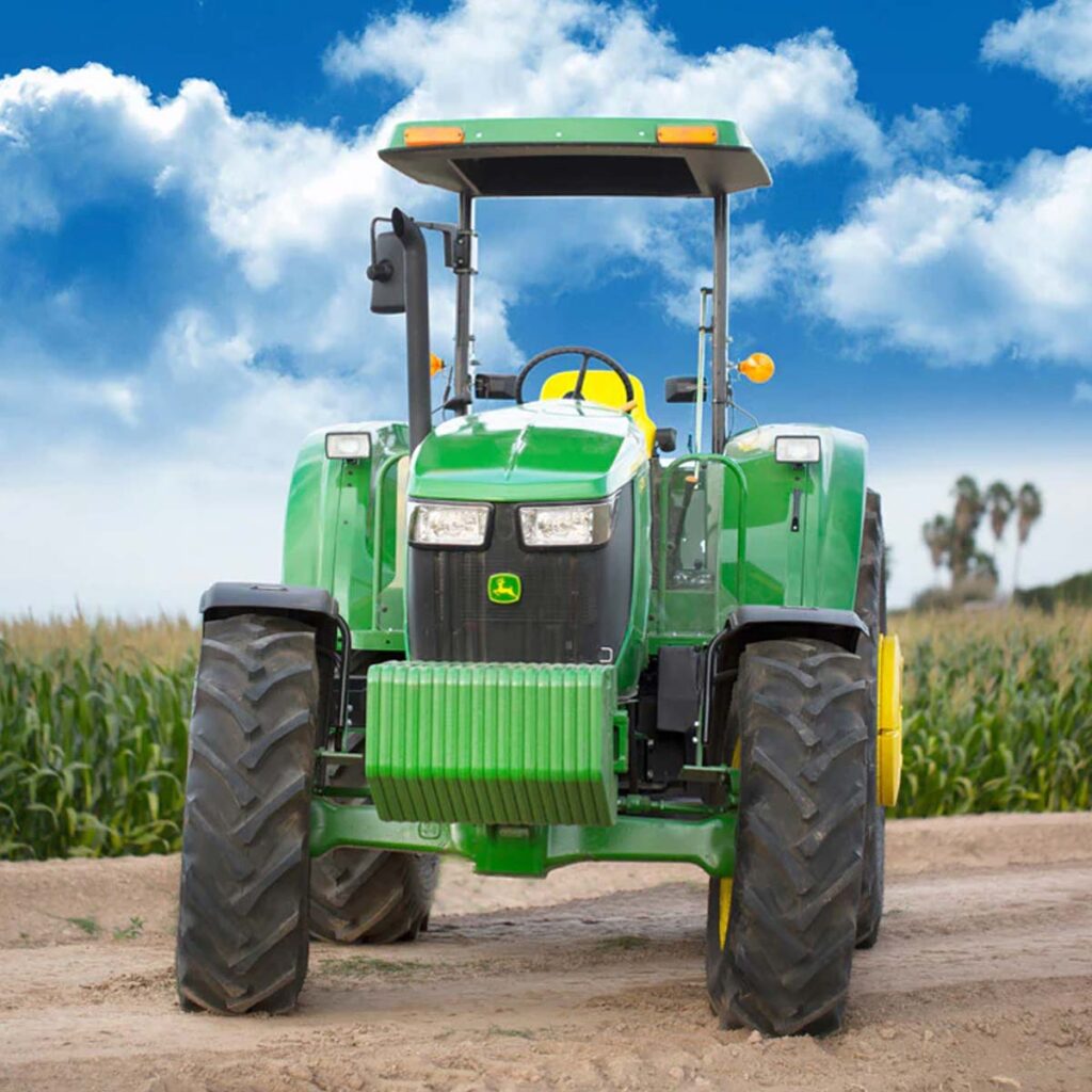 John Deere 6100M mid-sized utility tractor with front weights, crop farming